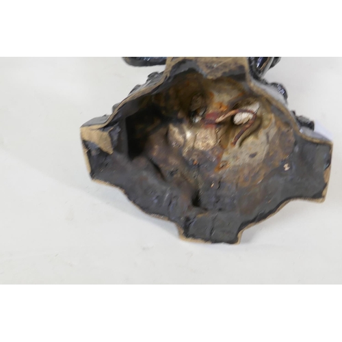 26 - A pair of antique painted metal candlesticks in the form of blackamoors, 41cm high