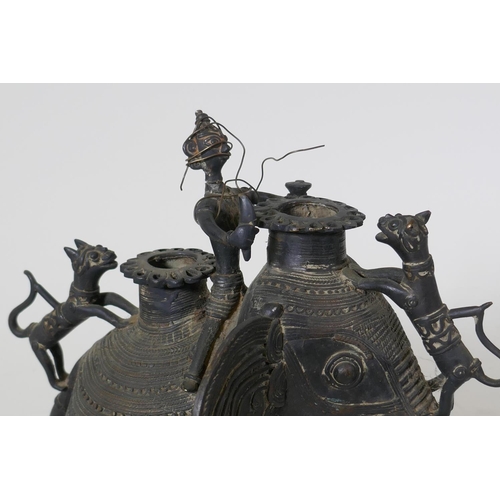 27 - African metal censer in the form of an elephant with rider, and two lions, AF, 28cm high