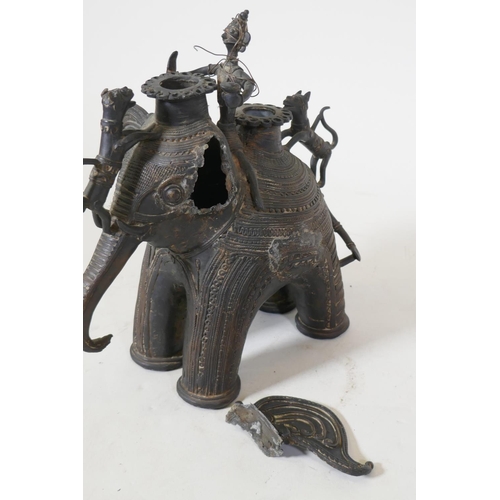 27 - African metal censer in the form of an elephant with rider, and two lions, AF, 28cm high