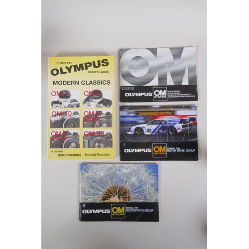 29 - An Olympus OM-4 Ti 35mm SLR camera, with two Olympus OM-system Zuiko lenses - OM 180mm F2.8 and OM 2... 