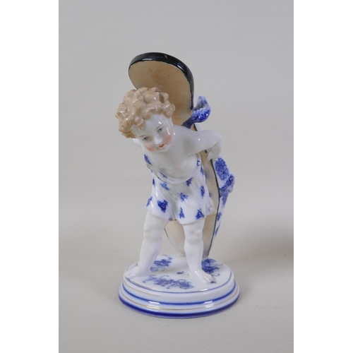 3 - A pair of early C20th continental porcelain posy holders/spoon warmers in the form of cherubs carryi... 