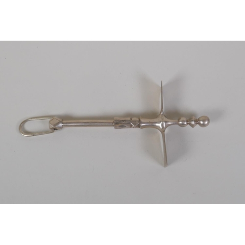 32 - A North African Tuareg white metal sugar hammer (tafadis), 23cm long