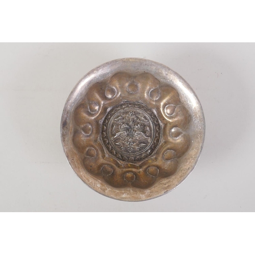 34 - A Chinese lotus shaped white metal ceremonial bowl, 4 character mark to base, 12cm diameter