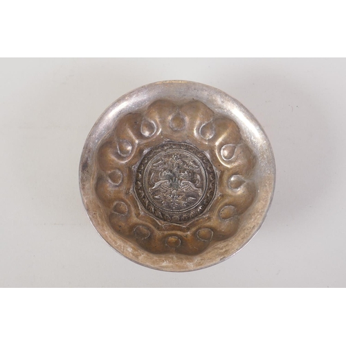 34 - A Chinese lotus shaped white metal ceremonial bowl, 4 character mark to base, 12cm diameter