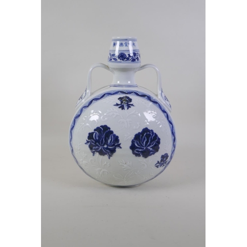 36 - A Chinese blue and white porcelain two handled moon flask with scrolling floral decoration, Xuande 6... 