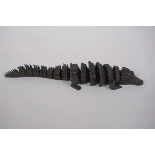 37 - A Japanese style bronze Jizai okimono alligator with articulated body, 19cm long