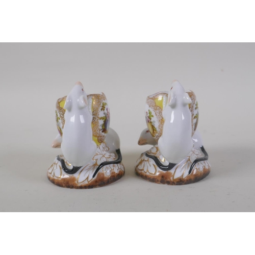 40 - A pair of Meissen porcelain posy holders in the form of two mice and an egg, decorated with pictoria... 