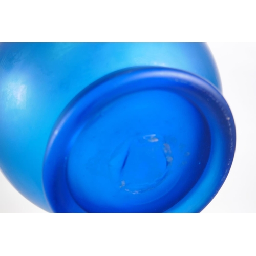 41 - A vintage art glass bottle vase, a hand blown two handled blue glass vase, and an iridescent art gla... 