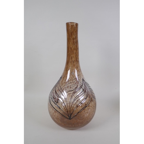 41 - A vintage art glass bottle vase, a hand blown two handled blue glass vase, and an iridescent art gla... 