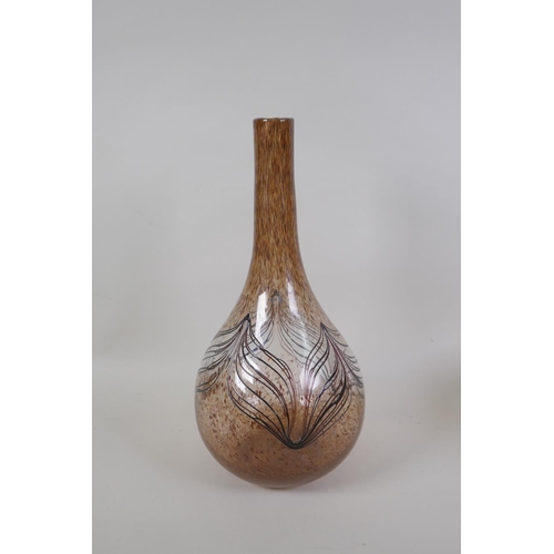 41 - A vintage art glass bottle vase, a hand blown two handled blue glass vase, and an iridescent art gla... 