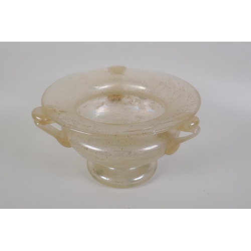 41 - A vintage art glass bottle vase, a hand blown two handled blue glass vase, and an iridescent art gla... 