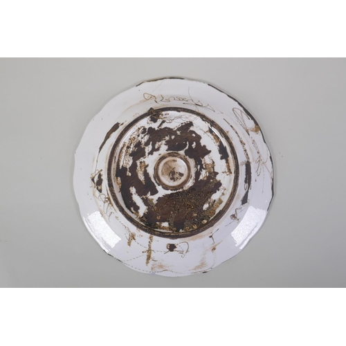 48 - A continental polychrome faience porcelain charger with lobed rim, decorated with an Iznik style des... 