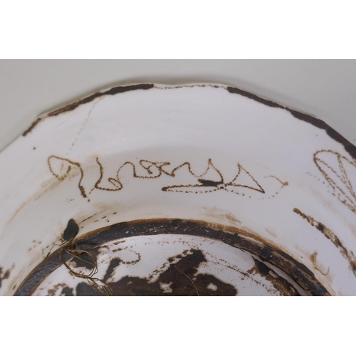 48 - A continental polychrome faience porcelain charger with lobed rim, decorated with an Iznik style des... 