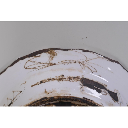 48 - A continental polychrome faience porcelain charger with lobed rim, decorated with an Iznik style des... 