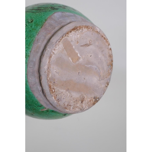 49 - An C19th Ottoman treacle glazed Canakkale pottery ewer with braided handle and applied floral decora... 