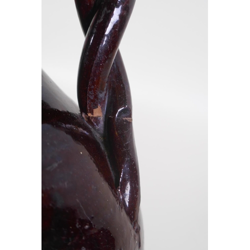 49 - An C19th Ottoman treacle glazed Canakkale pottery ewer with braided handle and applied floral decora... 