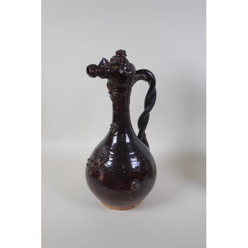 49 - An C19th Ottoman treacle glazed Canakkale pottery ewer with braided handle and applied floral decora... 