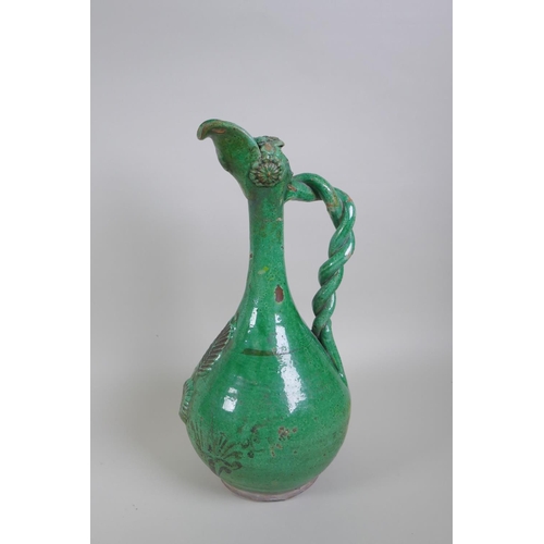 49 - An C19th Ottoman treacle glazed Canakkale pottery ewer with braided handle and applied floral decora... 