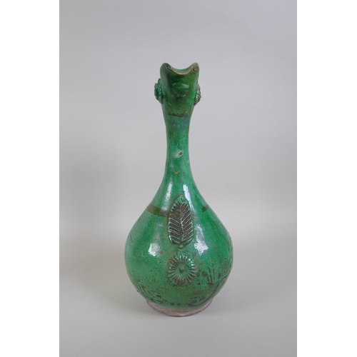 49 - An C19th Ottoman treacle glazed Canakkale pottery ewer with braided handle and applied floral decora... 