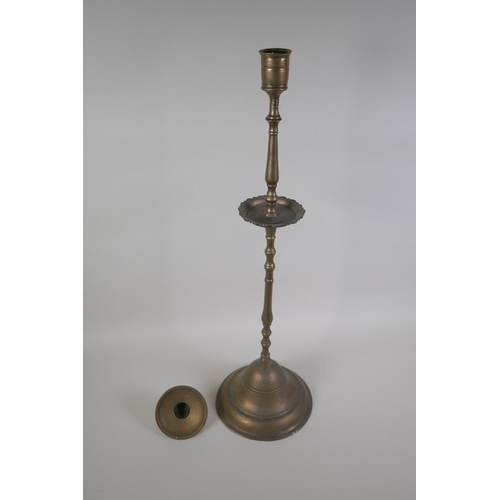5 - An antique Ottoman brass candlestick, probably C18th, 69cm high