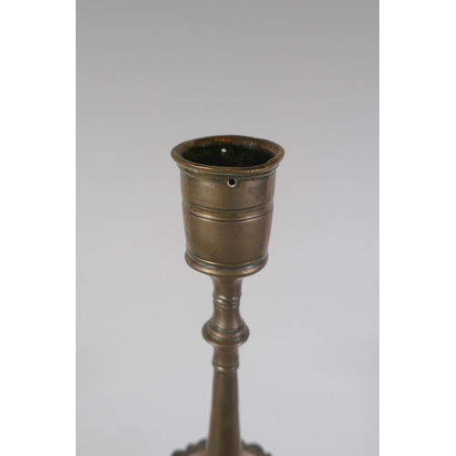 5 - An antique Ottoman brass candlestick, probably C18th, 69cm high