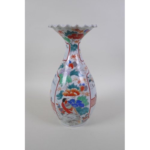 50 - A Japanese Meiji period Arita Imari porcelain vase, with decorative panels depicting a noble and gei... 
