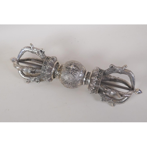 52 - A Tibetan white metal ceremonial vajra, 38cm long