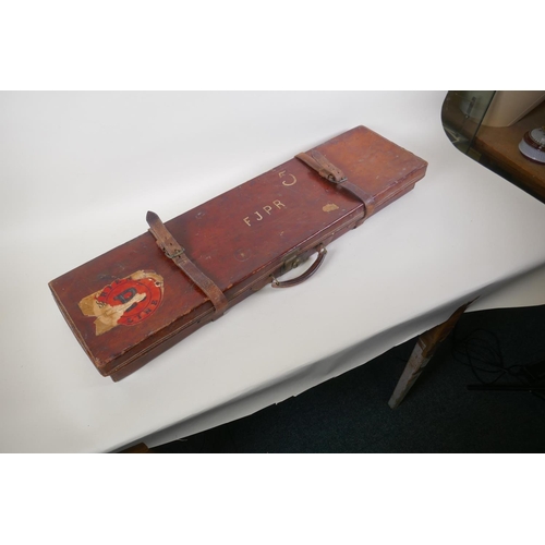 55 - A leather fitted shotgun case with cleaning rods, 84 x 23cm, 9cm high