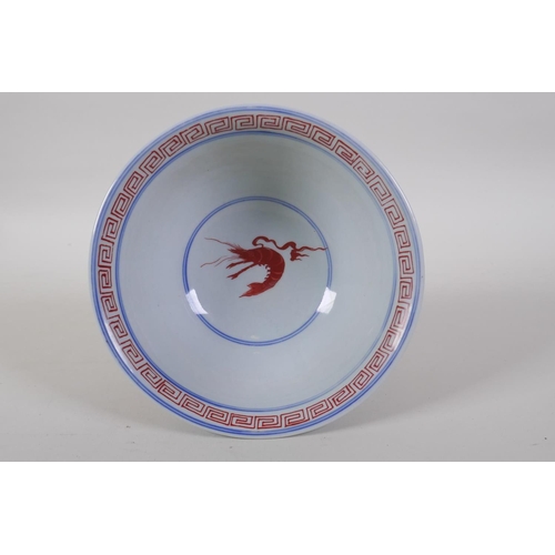 60 - A Chinese blue and white porcelain stem bowl with coral red decoration of mythical creatures, Wanli ... 