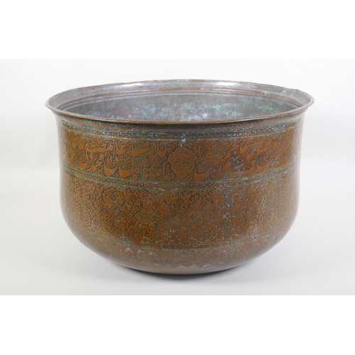 69 - A large C19th Indo Persian copper planter with all over floral and calligraphic decoration, dated 12...