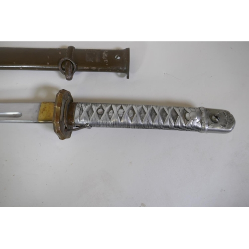 7 - A copy of a WWII Japanese Imperial Army NCO's Type 95 Shin Gunto sword, with aluminium hilt and bras... 