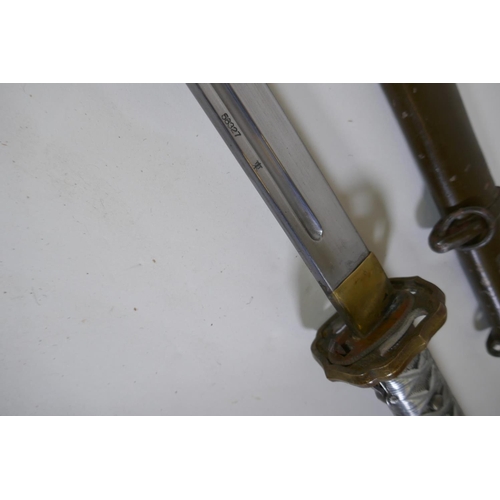 7 - A copy of a WWII Japanese Imperial Army NCO's Type 95 Shin Gunto sword, with aluminium hilt and bras... 