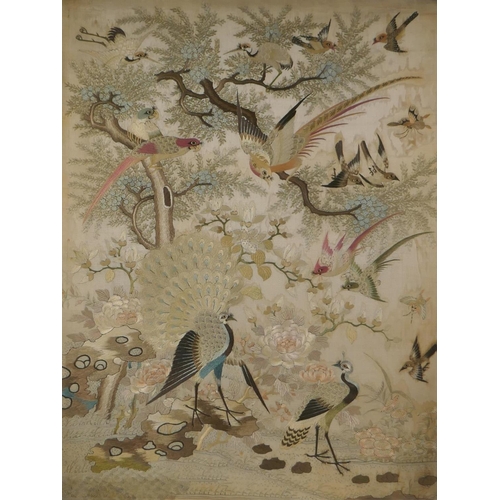 10 - An antique Chinese silk embroidered panel depicting Asiatic birds nestled in a tree, 41 x 52cm