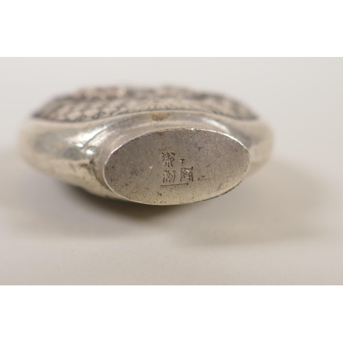 130 - A Chinese white met5al snuff bottle, with decorative raised panels depicting pandas, impressed marki... 