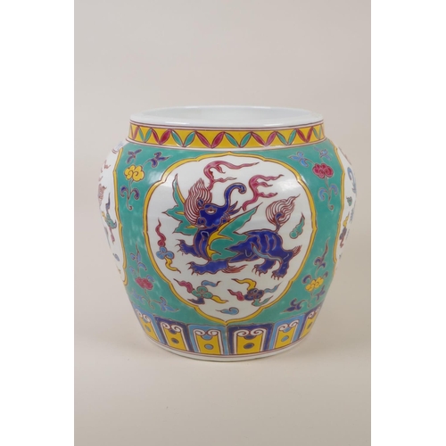 162 - A Chinese polychrome porcelain jar with decorative panels, depicting mythical creatures, 7 character... 