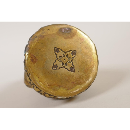 179 - A Sino-Tibetan filled gilt metal figure of Buddha, double vajra mark to base, 11cm high