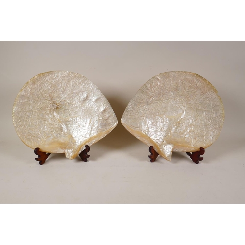 1 - A pair of C19th Chinese carved mother of pearl shells, late Qing Dynasty, decorated with figures in ...