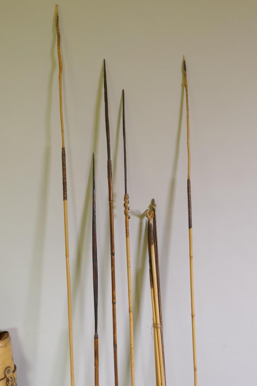 A quantity of African tribal throwing spears and arrows with bamboo and ...