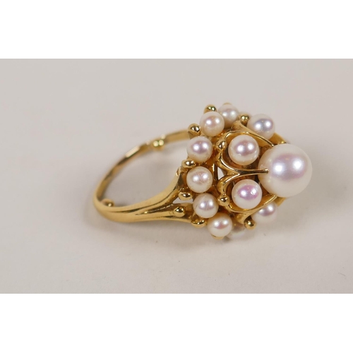 607 - A Japanese Mikimoto yellow metal and pearl cluster ring, probably 14ct, reduced and enlarged, 12.1g ...