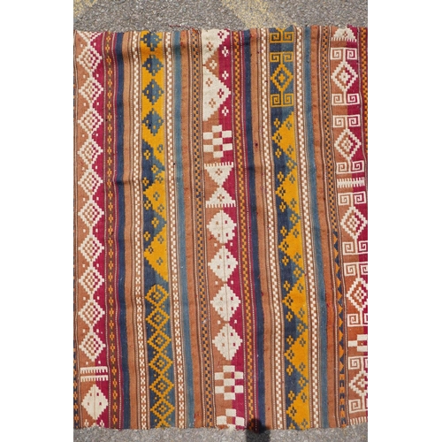 1040 - A Turkman multi colour kilim, 90 x 110cm, and belouch bag