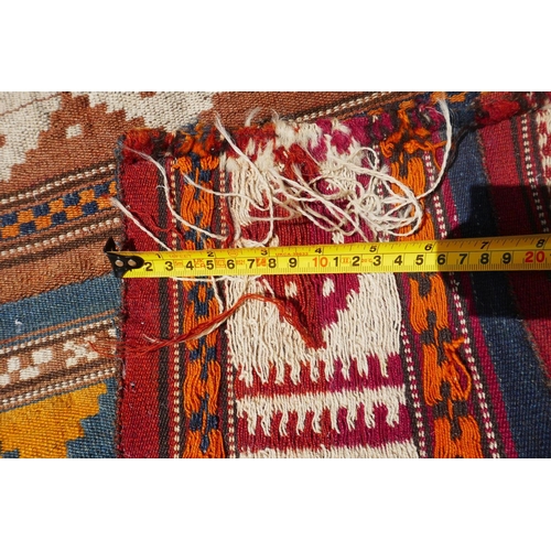 1040 - A Turkman multi colour kilim, 90 x 110cm, and belouch bag
