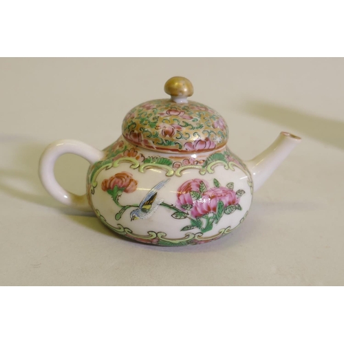 298 - A Chinese porcelain miniature teapot decorated in enamels with inscriptions, 9cm high, a famille ros... 