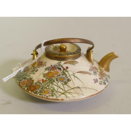 299 - Japanese Meiji Satsuma miniature teapot with finely painted floral decoration, marked to base, 8cm d... 