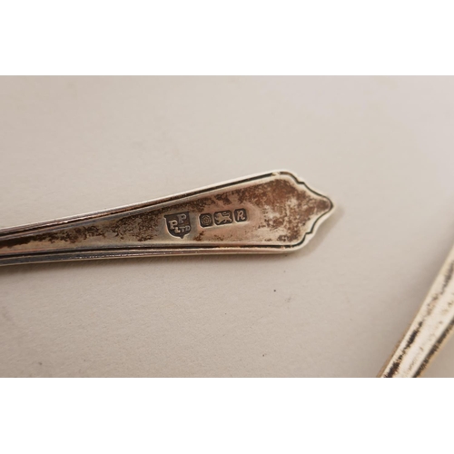 602 - A pair of silver clothes brushes with inset shagreen handles, two silver napkin rings, five silver t... 