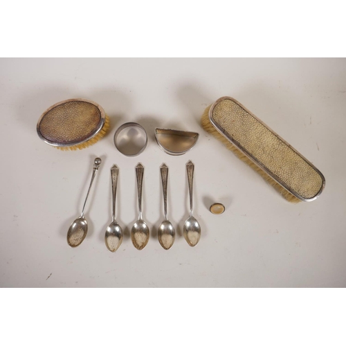 602 - A pair of silver clothes brushes with inset shagreen handles, two silver napkin rings, five silver t... 