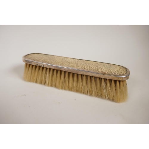 602 - A pair of silver clothes brushes with inset shagreen handles, two silver napkin rings, five silver t... 