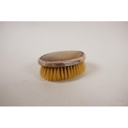 602 - A pair of silver clothes brushes with inset shagreen handles, two silver napkin rings, five silver t... 