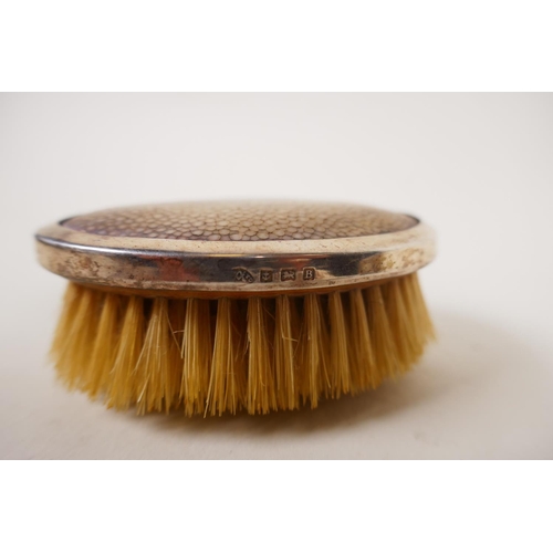 602 - A pair of silver clothes brushes with inset shagreen handles, two silver napkin rings, five silver t... 