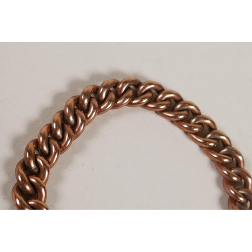 603 - A 9ct rose gold chain link bracelet with heart shaped padlock clasp, 15.2g