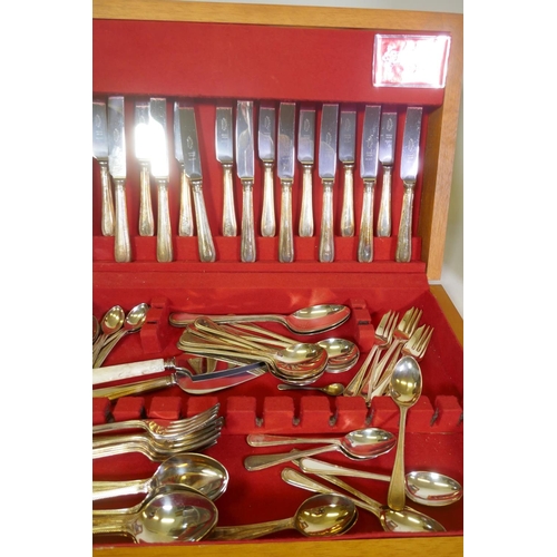 665 - A Sheffield silver plated eight place cutlery service in canteen, and a Vienna wall clock in later c... 